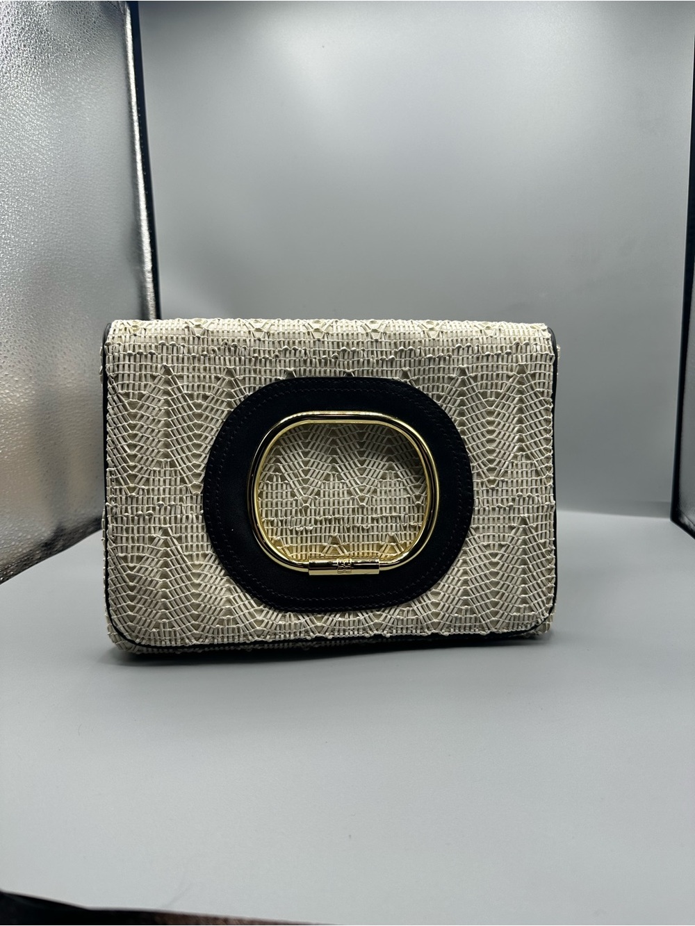 BCBG Cream Woven Clutch with Black Trim and Gold Accent
